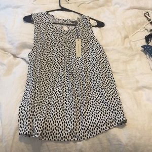 White and black polka dot blouse